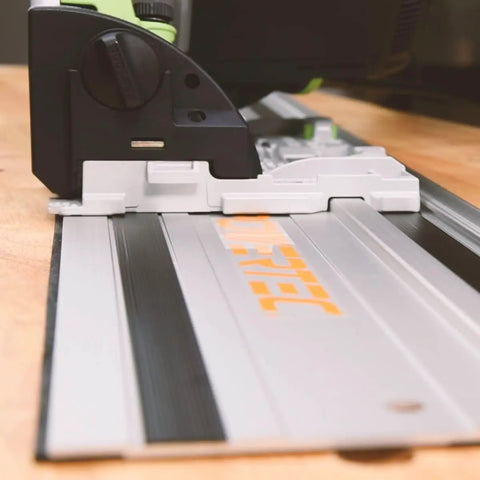Badass 110 Inch Track Saw Guide Rail Extension Kit With Two 55 Inch Aluminum Extrusion Rails Dual Quick Release Mounting Clamps And Seamless Track Connectors Tailored For Makita Or Festool Shop Rats close-up of track saw on aluminum track.
