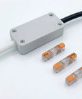 Heavy Duty Junction Box Tailored For Standard 221 Lever Nuts Rock Solid Inline Wire Splice Cover Case Supporting 3 Conductor Cables, white casing with connectors.