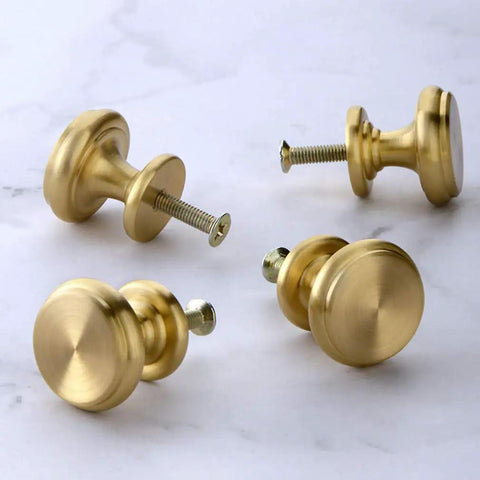 4 Piece Mid Century Modern Solid Brass Cabinet Knob Set for Drawers with 25mm Screws on marble surface