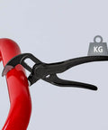 Cobra XS Pipe Wrench and Water Pump Pliers gripping red pipe, slim head design, 100 mm atramentized embossed surface visible