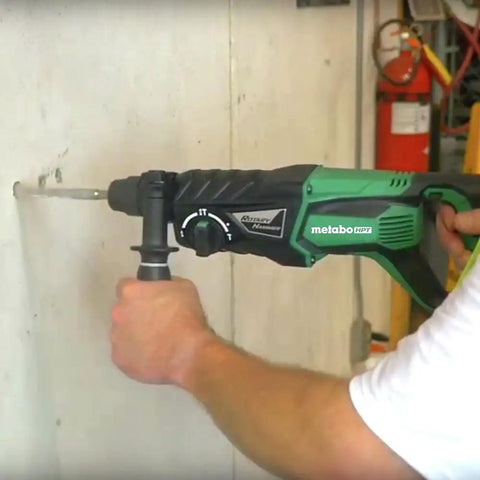 Hard Hitting Rotary Hammer Drill With SDS Plus, 1-Inch Chuck, 7.5 Amp Power For Fast Drilling, Chipping And Hammer Drilling In Concrete, Model DH26PF in use on concrete