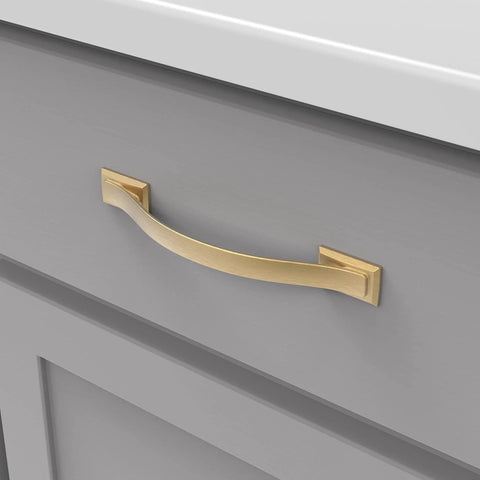 Solid Core Cabinet Pulls 10 Pack In Brushed Golden Brass Finish Dover Collection installed on gray cabinet drawer