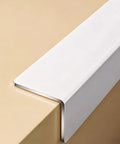 Heavy Duty Aluminum Corner Guard 89 Degree With Smooth Rounded Edge in white over beige surface