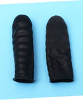 1000 Pack Antistatic Finger Cots Providing A No Sweat Grip That Shields Precise Electronics During Heavy Mechanic Work And Warehouse Tasks While Delivering Knockout Quality On A Tight Budget - Close-up of two black latex finger cots on blue background.