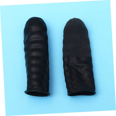1000 Pack Antistatic Finger Cots Providing A No Sweat Grip That Shields Precise Electronics During Heavy Mechanic Work And Warehouse Tasks While Delivering Knockout Quality On A Tight Budget - Close-up of two black latex finger cots on blue background.