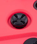 Close-up of button on Pocket Crush 2.4GHz ELRS Hall Gimbal Transmitter Remote Control, Ultra Portable Foldable Radio, Cherry Red