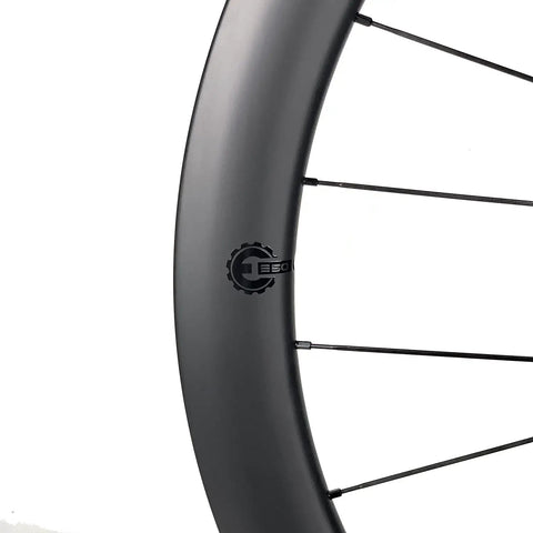 Close-up of 50mm Matte Carbon Road Wheelset With Center Lock Disc Brakes 700c Beefy 28mm Rim Fits 25C To 38C Tires UCI Approved U Shaped Design