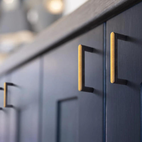 Set Of 6 Cabinet Pulls 3 Inch Center To Center Antique Brass Finish installed on blue cabinet door