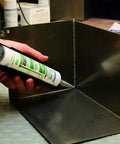 Applying Flex 310 M HT 200 Go To High Temp HVAC Adhesive And Sealant For Ducts And Metal 10.5 Oz Cartridge to metal corner