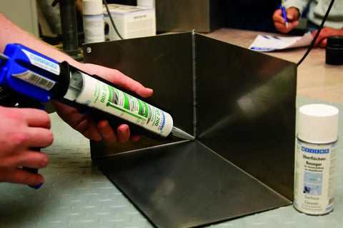 Applying Flex 310 M HT 200 Go To High Temp HVAC Adhesive And Sealant For Ducts And Metal 10.5 Oz Cartridge to metal corner