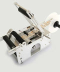 Heavy Duty Semi Auto Round Bottle Labeler For 15 To 120 Mm Containers Runs Like Clockwork At Forty Labels Per Minute featuring a smooth feed reel.