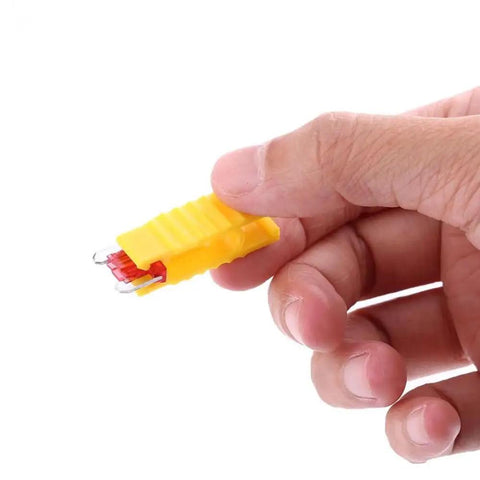 Hand holding a yellow 120 Pcs Mini Car Blade Fuses Kit For Cars Vans Bikes Trucks Boats And SUVs 2A To 35A Auto Fuse Assortment