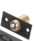 Heavy Duty Adjustable Ball Door Catches Black Brass Roller Latch Tension Hardware For Closet Cupboard And Cabinet With Invisible Design For Home And Office Use close-up of black brass latch with ball component.