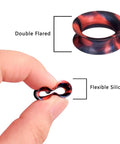 Close-up of colorful silicone ear gauge plug, double flared, held between fingers, emphasizing flexibility for everyday wear.