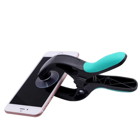 Dudes Totally Vouch For This Slick Four In One Cell Phone Repair Tool Kit Packed With Precision Screwdriver Suction Cup Plier And Dual Hinged Blade Opener For No Sweat Lcd Screen Fixes. Suction plier gripping a smartphone screen.