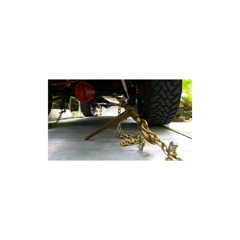 Heavy Duty Ratchet Load Binder For 3/8 To 1/2 Inch Grade 70 Transport Chain in use, securing vehicle, yellow finish.