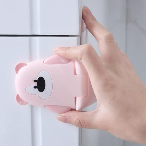 Close-up of pink Bear Shaped Kidproof Safety Locks For Cabinets And Drawers With Double Button Release, ABS Material