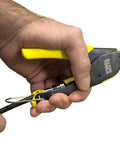 Close-up of hand using Coax Installation Kit With Crimp Tool, Cable Cutter, Stripper and F Connectors on black coax cable.