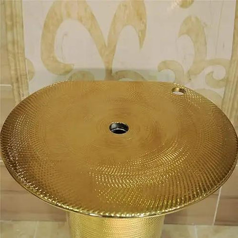 Close up of the top of the Straight Up Sleek 16 Inch Gold Ceramic Vessel Sink showing the textured surface and drain hole.