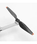 Premium Carbon Fiber Propeller Blades Compatible with Mini 3 Pro and Mini 4 Pro Genuine 6030F Rotors showing a close-up view of the blades.