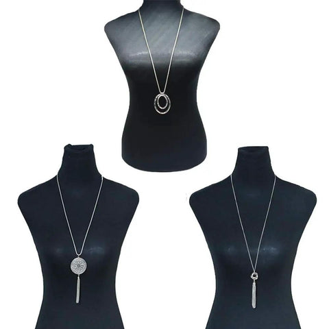 Display of Six Piece Long Pendant Necklace Set For Women With Tassel, Knot, Disk And Circle Designs In Gold Tone