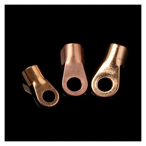 Check Out This Awesome 70 Pack Of Premium Copper Circular Splice Terminals And Wire Connectors Including All Sized OT Open Ring Lugs For Battery Cables With High Amp Assortment Kit That Makes Wiring A Total Breeze. Three copper OT open ring lugs on black background