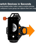 Image of NexGO Universal Smartphone Adapter attached to telescope, showcasing phone with moon photo and orange slider for easy device switching.