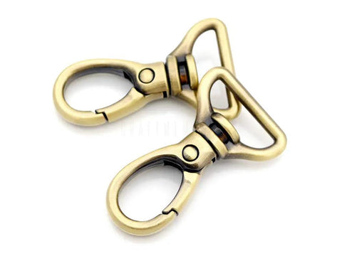 Oval Snap Hooks Heavy Duty Push Gate Swivel Lobster Clasp Keychain Clip For Purse Making And Bag Straps, Three Quarter Inch Brushed Brass Finish, 2 Pack, shown front view.