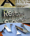 Metal letters created by Pneumatic Dual Axis Letter Bender For LED Signs, showcasing precision bending on aluminum and stainless steel.