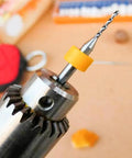 Close-up of drill with 40 Pcs PCB Micro Drill Bit Set 0.1mm To 1.0mm Shank Spiral Tungsten Steel Carbide Bits for PCB Circuit Board Engraving CNC.