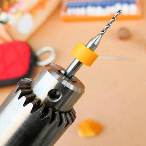 Close-up of drill with 40 Pcs PCB Micro Drill Bit Set 0.1mm To 1.0mm Shank Spiral Tungsten Steel Carbide Bits for PCB Circuit Board Engraving CNC.