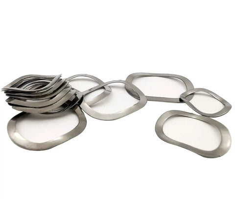 Hella Tough Stainless Steel Wave Spring Washer Assortment Kit Holds 145 Pieces From M3 To M27 showing various wave spring washers in a pile.