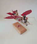 Air-Ship Stirling Engine Model Kit for Adults with red wings, metal body, on wooden base, 3D steampunk kinetic art decor