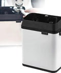 Robust Electric Portafilter Cleaning Station With Integrated Knock Box For Weekend Warriors And Cafe Pros Knocks Out Wet Pucks Instantly, showing integrated knock box and cleaning unit.