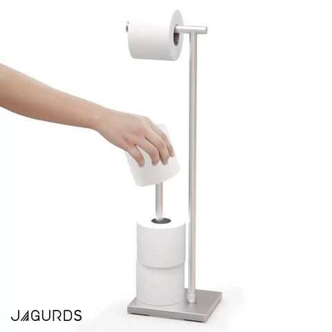 Hand using Freestanding Toilet Paper Holder With Storage For Jumbo Rolls Holds Up To Four Rolls No Fuss Easy Access Stand Up Bathroom Organizer Modern Sleek Design Keeps Your Restroom Neat And Ready, stainless steel.