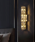 Gold Crystal LED Wall Light Sconce Dope Modern Elegant Wall Mount Lamp illuminating dark wall in bedroom