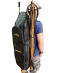 Person wearing Long Fin Utility Spearfishing Backpack for Freediving and Snorkeling with side pockets and rugged dry bag style.