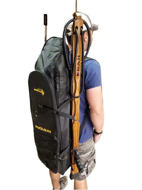 Person wearing Long Fin Utility Spearfishing Backpack for Freediving and Snorkeling with side pockets and rugged dry bag style.