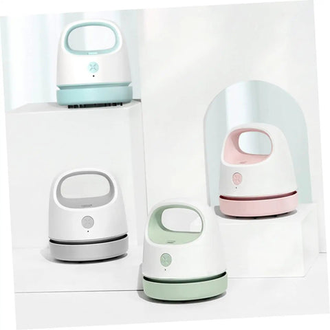 Fuss Free Rechargeable Desktop Vacuum Cleaner That Knocks Dust And Pet Hair To The Curb In Seconds in four color variations on display.