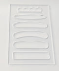Six In One Charcuterie Board Handle Template Acrylic Router Guide For Carving Out Smooth Corner Grips On Cutting Boards And Serving Trays Street Tested Woodworking Jig Game Changing DIY Shop Essential clear acrylic template showing six grip profiles