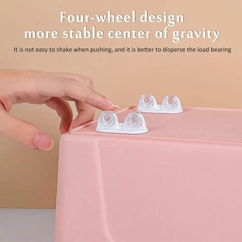 Hand installing 12 Pack Self Adhesive Mini Caster Wheels With Precision Ball Bearings For Storage Shelves And Furniture on pink bin
