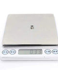 Miniature metal shielded ball bearing L-740ZZ on digital scale; 4x7x2.5 mm ABEC-5.
