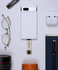 Ultra Fast 256GB External SSD With Dual USB Type C And Type A Ports displayed with smartphone and tech accessories