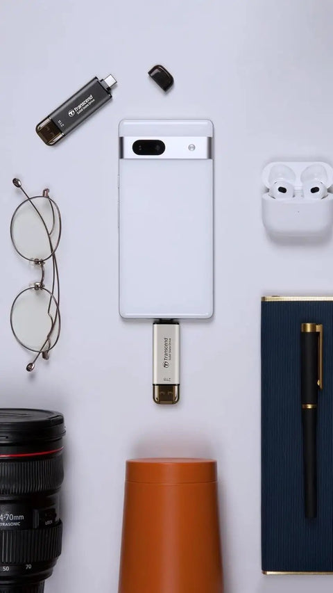 Ultra Fast 256GB External SSD With Dual USB Type C And Type A Ports displayed with smartphone and tech accessories