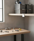 Heavy Duty Steel Corner Shelf Connector Bracket For DIY Shelving, 90 Degree Joint in workshop, silver finish, tools on table