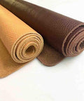 Rock Solid Wide Flat Leather Straps, Knockout Full Grain Cowhide Hide Sheet In Warm Brown Red, 39 By 39 Inches Featuring Natural Litchi Grain Matte Finish For Crafting, rolled leather sheets in warm tones.