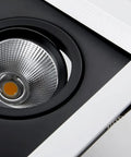 Top Shelf Quad Head Gimbal Recessed Lights 4 Pack swivel LED spotlight with sleek black and silver finish, showing the reflective lens.