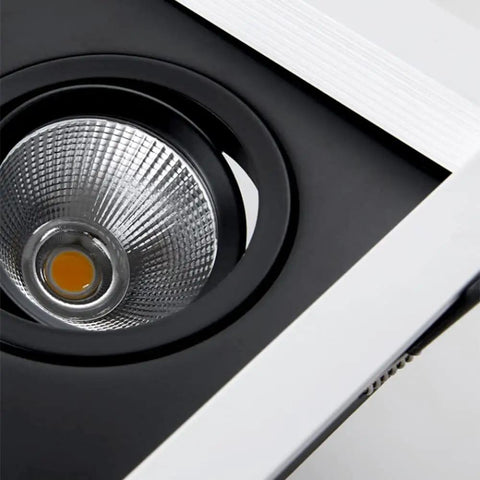 Close-up of 4 Pack Adjustable Recessed Led Downlights With Snap Swivel Angles and Clean Aluminum Trim, showcasing heat sink body.