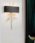 Modern Copper Wall Sconce Featuring Brushed Stainless Steel Shade For Bedrooms Hallways And Living Rooms A Hella Stylish Straight Upgrade That Brings Major Ambiance And Keeps Your Setup Looking Fire on white wall with decorative branches.