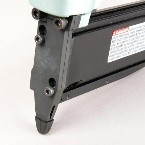 Close-up of the tip of the 23 Gauge Pin Nailer Kit For Fine Trim And Molding Pneumatic Nailer With Built In Silencer NP50A
